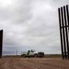Photo: A Border Patrol vehicle is parked near the U.S.-Me Photo: A Border Patrol vehicle is parked near the U.S.-Me