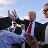 Photo: President Donald Trump reaches out to greet suppor Photo: President Donald Trump reaches out to greet suppor