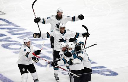 San Jose Sharks celebrate after scoring in the second overtime to beat the Vegas Golden Knights 2-1 in Game 6 of an NHL hockey first-round playoff series at T-Mobile Arena Sunday, April 21, 2019.