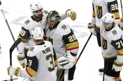 Golden Knights goaltender Marc-Andre Fleury reacts with right wing Alex Tuch (89), defenseman Brayden McNabb (3) and center William Karlsson (71) after losing to the San Jose Sharks during overtime of Game 7 of an NHL hockey first-round playoff series in San Jose, Calif., Tuesday, April 23, 2019.