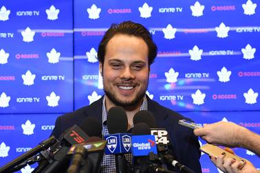 In this Tuesday, Feb. 5, 2019 file photo, Toronto Maple Leafs center Auston Matthews smiles at a press conference in Toronto. Auston Matthews could soon wear the “C” as the long-term captain in Toronto. But he also got razzed by his Maple Leafs teammates for doing a stylish GQ fashion photo shoot.