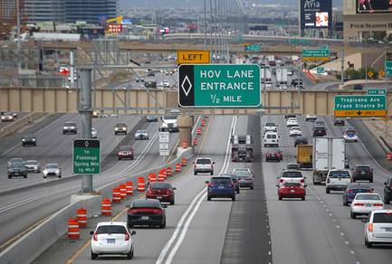 Cars use the High Occupancy Vehicle lane on northbound Interstate 15 near Sunset Road Wednesday, May 22, 2019. The new HOV lanes opened Monday.
