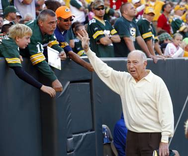 In this Sept. 10, 2012, file photo, former Green Bay Packers quarterback Bart Starr waves to fans during the Packers' NFL football game against the San Francisco 49ers in Green Bay, Wis. Bart Starr, the Green Bay Packers quarterback and catalyst of Vince Lombardi's powerhouse teams of the 1960s, has died. He was 85.
