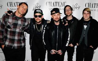 Dean Butterworth, Joel Madden, Benji Madden, Billy Martin and Paul Thomas of Good Charlotte arrive at Chateau Nightclub & Gardens at the Paris on Dec. 30, 2011.
