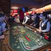 Gamblers play craps on the casino floor of the Cromwell on the Las Vegas Strip, Monday, April 21, 2014.