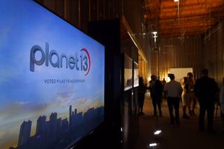 A video plays during a news conference for the Planet 13 Superstore dispensary, a cannabis entertainment complex, under construction on Desert Inn Road near The Strip Thursday, July 19, 2018. Phase 1, expected to be complete in November 2018, will include an interactive entertainment space and more than 16,500 sq. ft. of retail space.