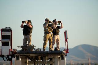 Secret Service Agents provide security as President Trump arrives at McCarran International Airport Thursday Sept. 20, 2018.