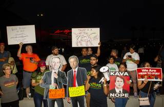 Protesters gather outside the Las Vegas Convention Center during a Trump MAGA rally, Thursday, Sept. 20, 2018.